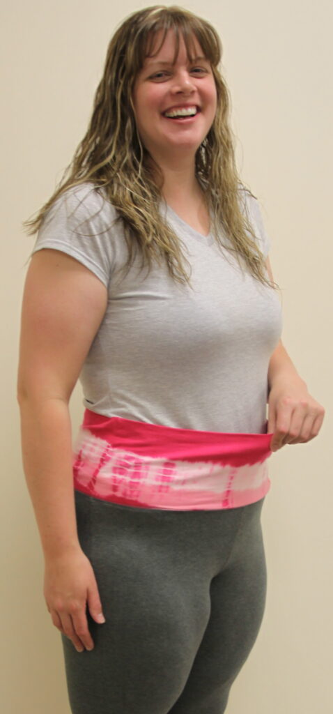 Woman wearing a body wrap over casual clothing for fitness