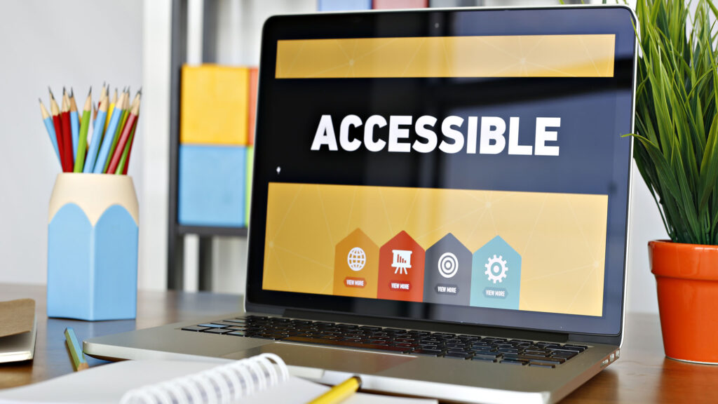 Laptop screen with accessible website interface and icons