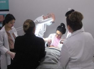 Group of medical professionals performing a procedure in a clinic