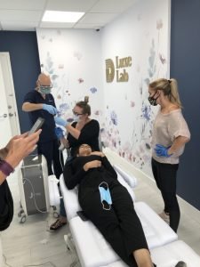 Medical spa procedure with team in Luxe Lab