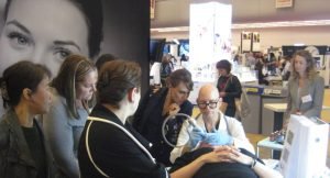 Dermatology expert demonstrates skincare procedure at medical conference