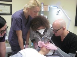 Medical team performing detailed cosmetic skin procedure