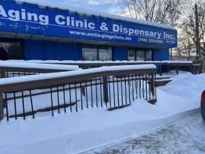Anti-aging clinic with snow-covered ramp in winter