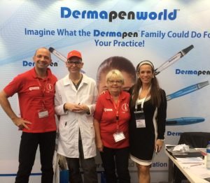 Team showcasing Dermapen microneedling products at a trade event