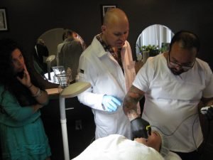 Dermatologists performing facial procedure at a skincare clinic