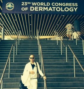 Visitor at 23rd World Congress of Dermatology entrance stairs