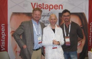 Three men at the Vistapen dental conference booth